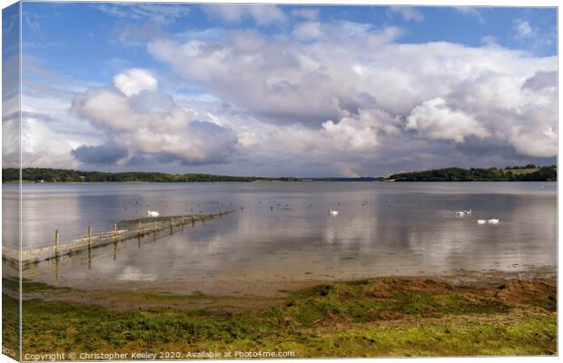 Cloudy skies over Rutland Water Canvas Print by Christopher Keeley