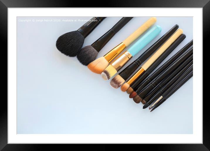 set of various professional cosmetic makeup brushes on a light background close-up Framed Mounted Print by Sergii Petruk