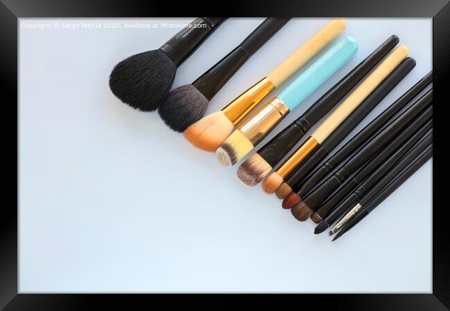 set of various professional cosmetic makeup brushes on a light background close-up Framed Print by Sergii Petruk