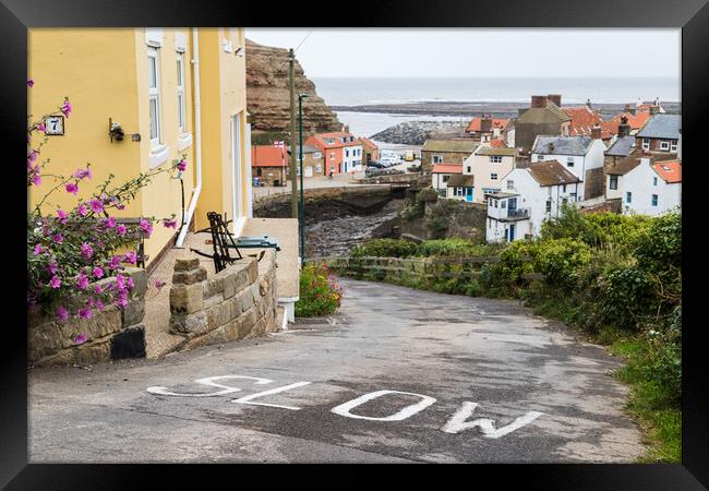 Steep road leading into Staithes Framed Print by Jason Wells