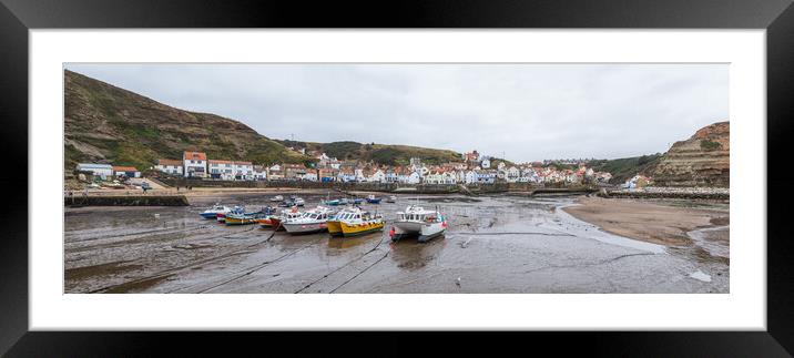 Boats lined up in the bay at Staithes at low tide Framed Mounted Print by Jason Wells
