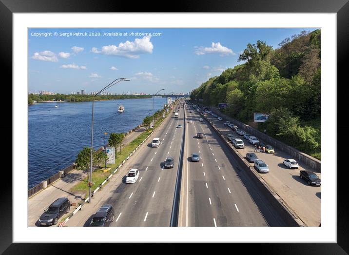 The city route of Kiev goes along the embankment of the Dnieper River Framed Mounted Print by Sergii Petruk