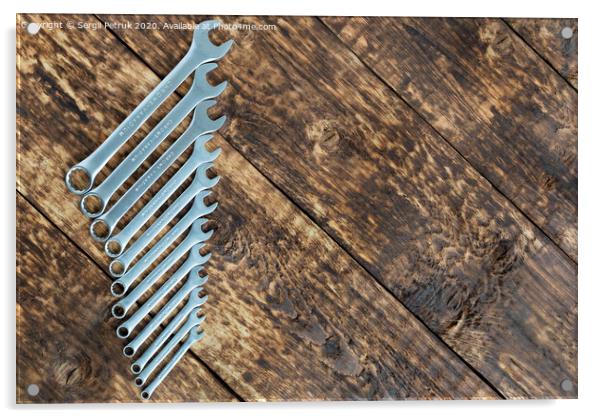 set of wrench against old wooden boards background Acrylic by Sergii Petruk