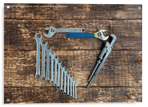 Set of combination wrenches and old adjustable wrenches on an old wooden background Acrylic by Sergii Petruk