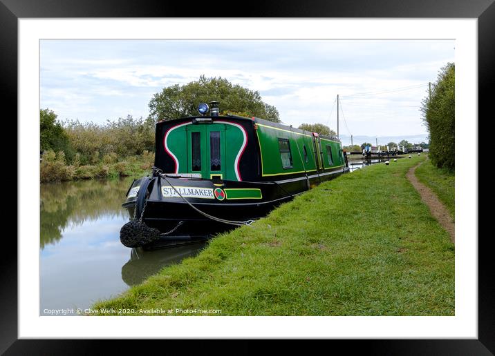 Narrow boat moored up in front of lock gates. Framed Mounted Print by Clive Wells