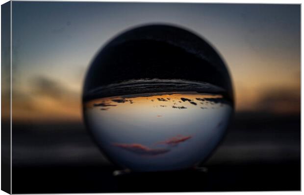 Abstract sunset through the crystal ball Canvas Print by Andrew chittock