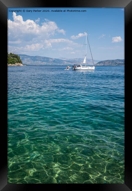 The clear waters of Kalami Bay, in Corfu, Greece, on a bright summers day	 Framed Print by Gary Parker