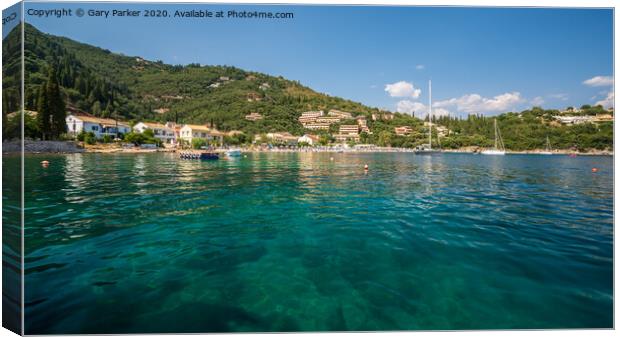The clear waters of Kalami Bay, in Corfu, Greece, on a bright summers day	 Canvas Print by Gary Parker