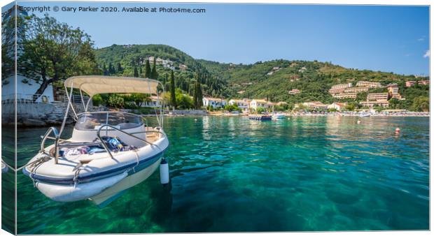 The clear waters of Kalami Bay, in Corfu, Greece, on a bright summers day	 Canvas Print by Gary Parker