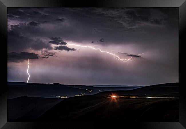 Lightning Strike on the mountain Framed Print by Emma Woodhouse