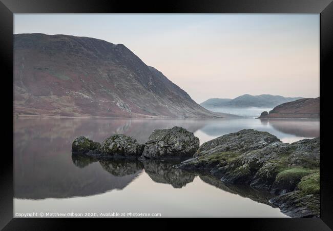Stunning Winter foggy sunrise on Crummock Water in Lake District England Framed Print by Matthew Gibson