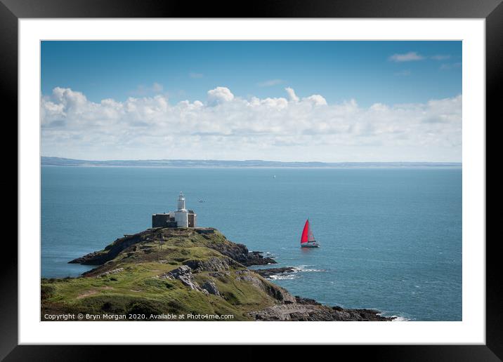 Yacht passing Mumbles lighthouse Framed Mounted Print by Bryn Morgan