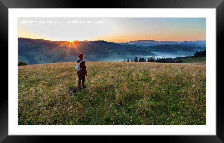 A young woman meets a dawn on a meadow hill in the Carpathian Mountains Framed Mounted Print by Sergii Petruk