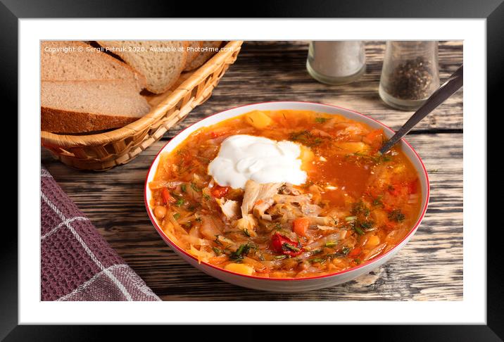 Ukrainian borsch in a white porcelain dish on an old wooden table Framed Mounted Print by Sergii Petruk