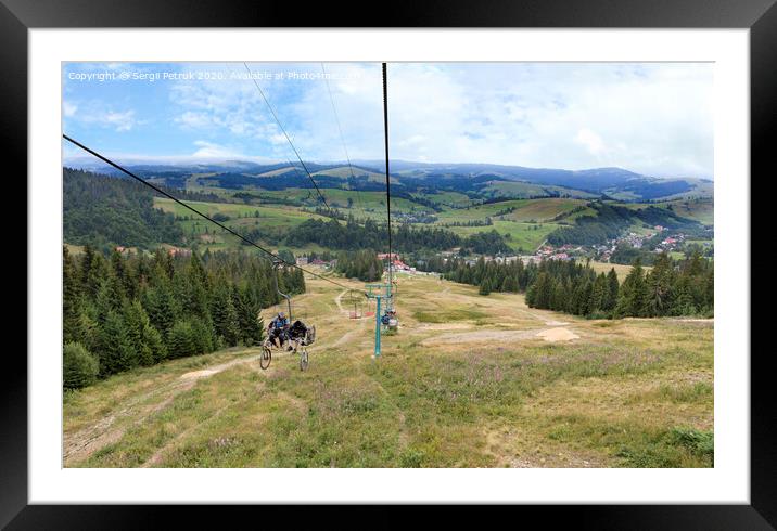 Chairlift with a mountain landscape of the Karpat mountains Framed Mounted Print by Sergii Petruk