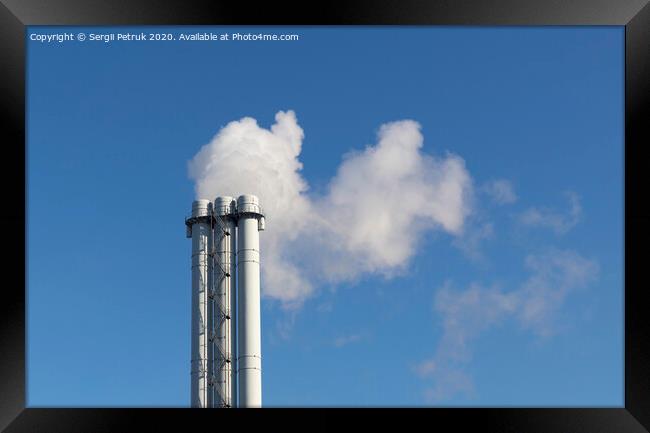 White smoke comes from a white chimney pipe on a background of blue sky. Framed Print by Sergii Petruk