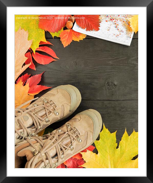 Autumn leaves, tracking boots and maps on a black background of an old tree Framed Mounted Print by Sergii Petruk