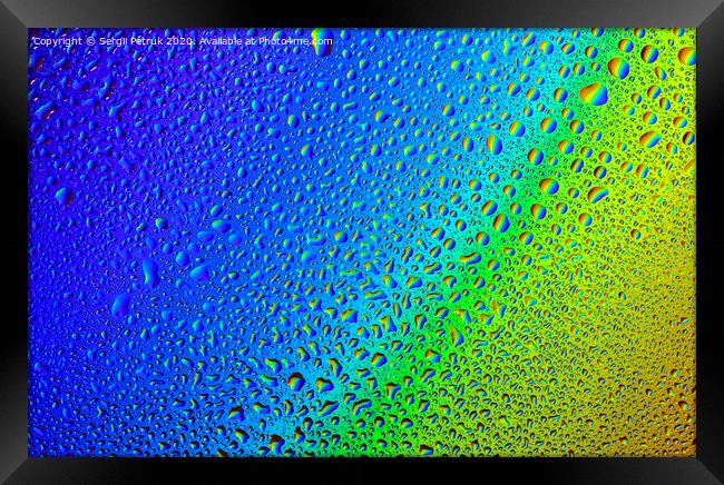 Drops of water on a rainbow background. Framed Print by Sergii Petruk