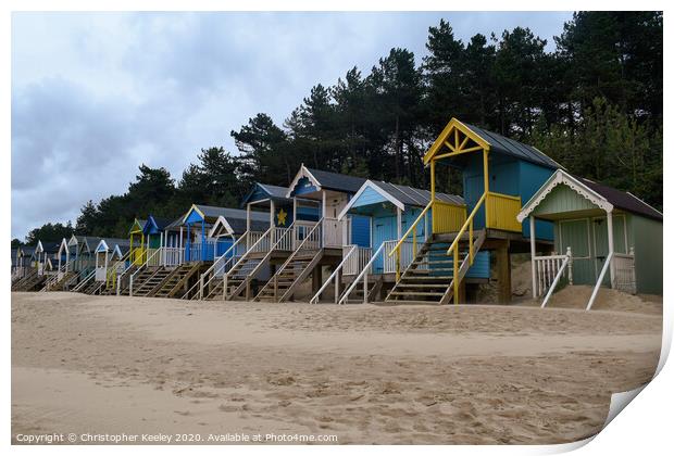 Wells beach huts Print by Christopher Keeley