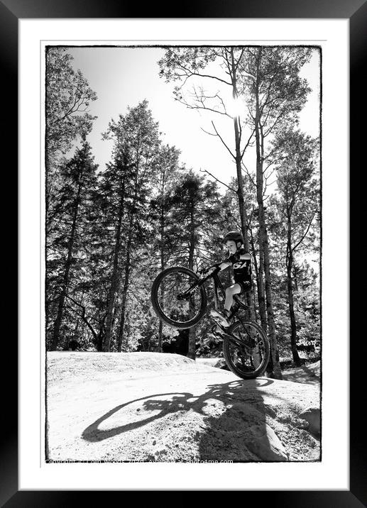 Child popping a wheelie Framed Mounted Print by Colin Woods
