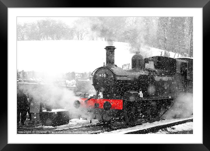 Steam train in snow Framed Mounted Print by Christian Bridgwater