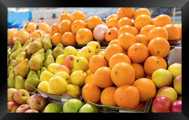 oranges, apples, pears lie on the market counter for sale Framed Print by Sergii Petruk