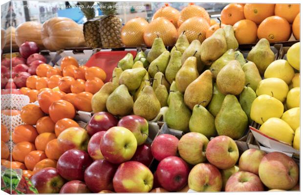 oranges, apples, pears, pineapple, pomegranate, pumpkin, persimmonlie on the market counter for sale Canvas Print by Sergii Petruk