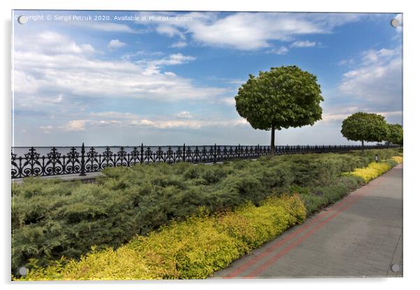 A cobbled stepped path along the embankment of the river, framed by a metal decorative fence cut off by bushes and trees in a beautiful park Acrylic by Sergii Petruk