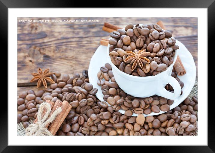 Grain coffee in a cup. Cinnamon on a platter and tied with string. Anise stars complement the aroma of coffee. Framed Mounted Print by Sergii Petruk