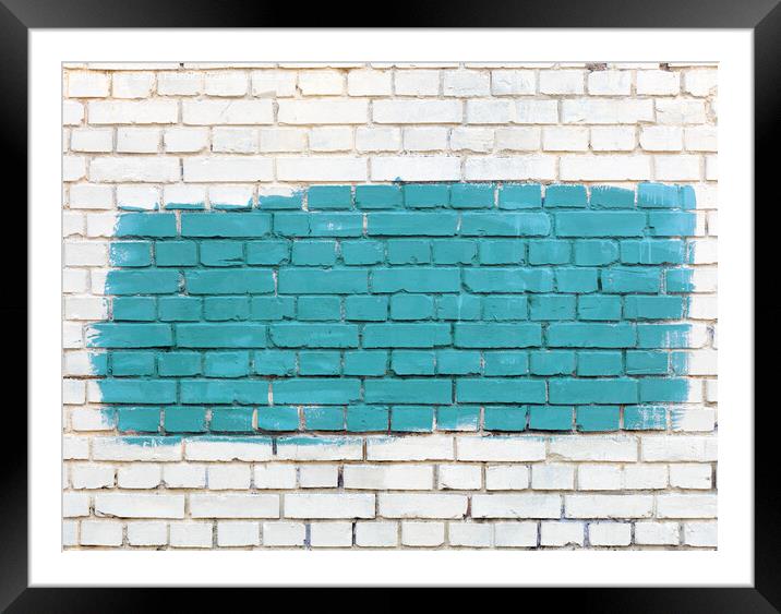 On the white old brick wall the selected fragment is painted with green paint. Framed Mounted Print by Sergii Petruk
