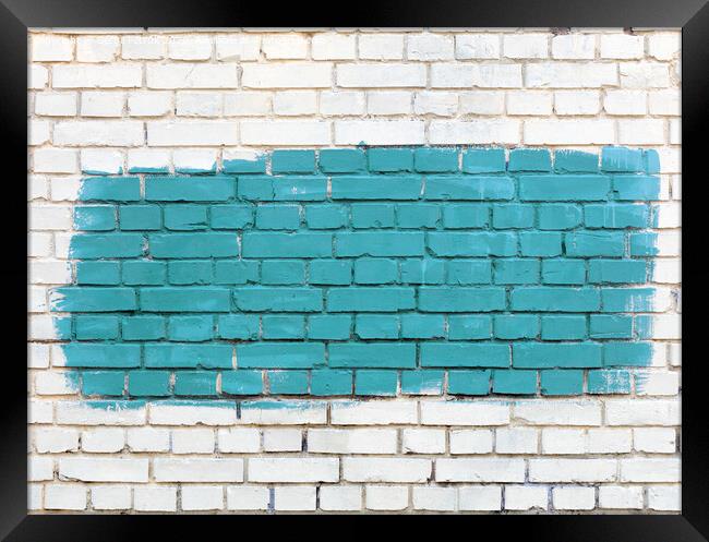 On the white old brick wall the selected fragment is painted with green paint. Framed Print by Sergii Petruk