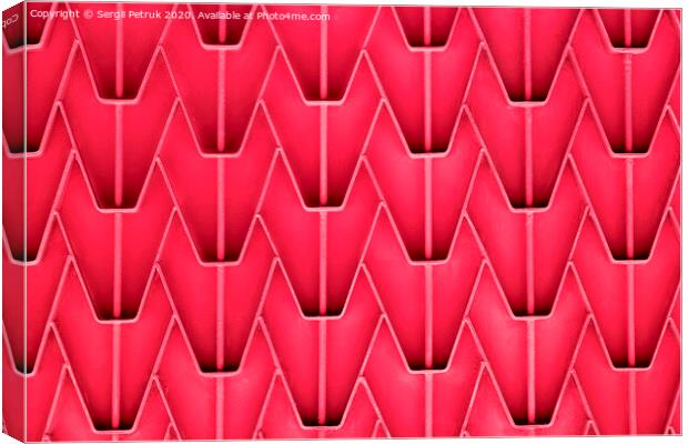 A patterned metal fence with outdated bright red paint. Abstract texture background. Canvas Print by Sergii Petruk