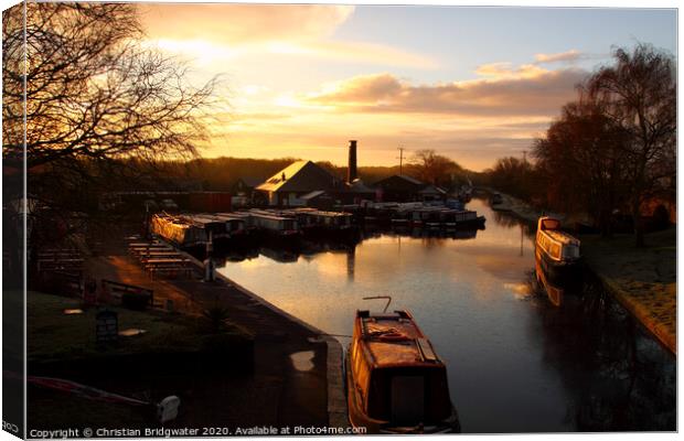 Barges at sunrise at Norbury Junction on the Shropshire Union Canal in Staffordshire, England, UK Canvas Print by Christian Bridgwater