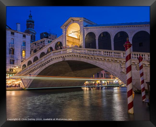 Rialto Bridge in Venice Framed Print by Chris Dorney