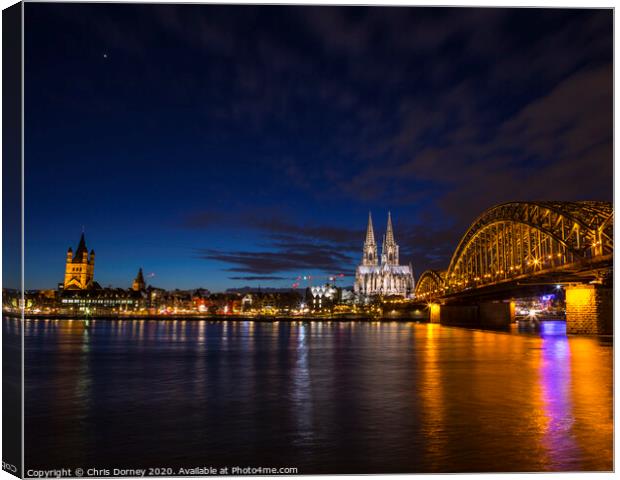 Planet Venus over the City of Cologne in Germany Canvas Print by Chris Dorney