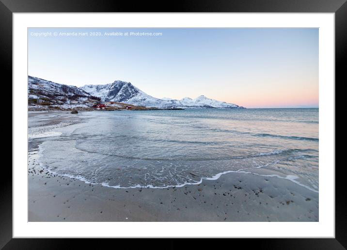 Snowy mountains from a beach in Norway Framed Mounted Print by Amanda Hart