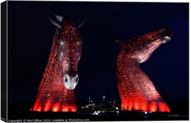 The Kelpies in red. Canvas Print by Paul Clifton