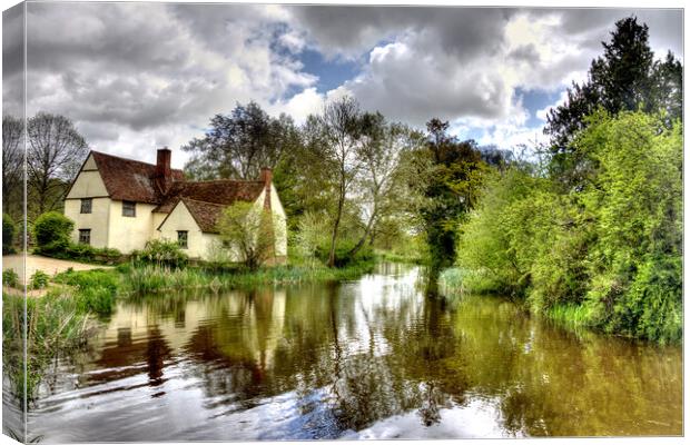 Storm clouds over Willy Lott's Cottage - Flatford  Canvas Print by David Stanforth