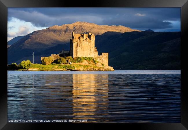 Eilean Donan Castle reflected in the evening light Framed Print by Chris Warren