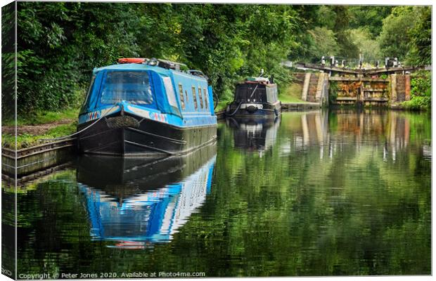 Two narrow boats and a lock gate. Canvas Print by Peter Jones