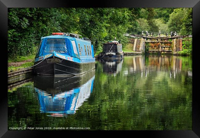 Two narrow boats and a lock gate. Framed Print by Peter Jones