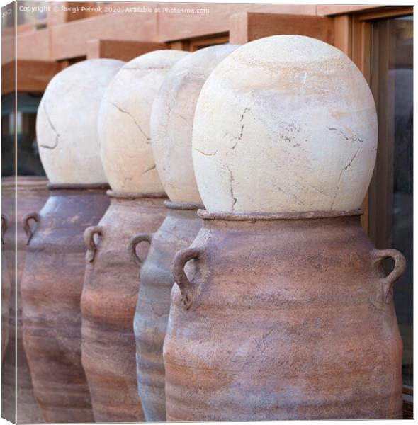Large clay pots in a row for sale Canvas Print by Sergii Petruk