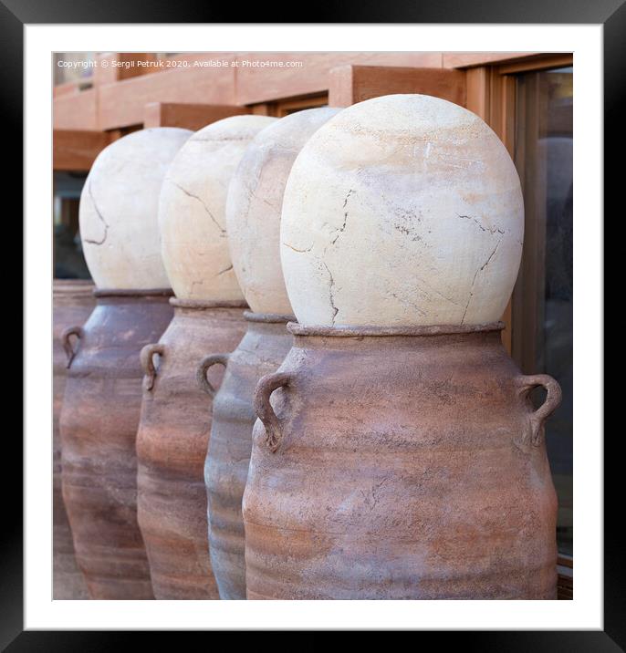 Large clay pots in a row for sale Framed Mounted Print by Sergii Petruk