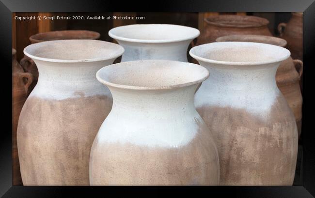 Large clay amphorae for water in a row for sale Framed Print by Sergii Petruk