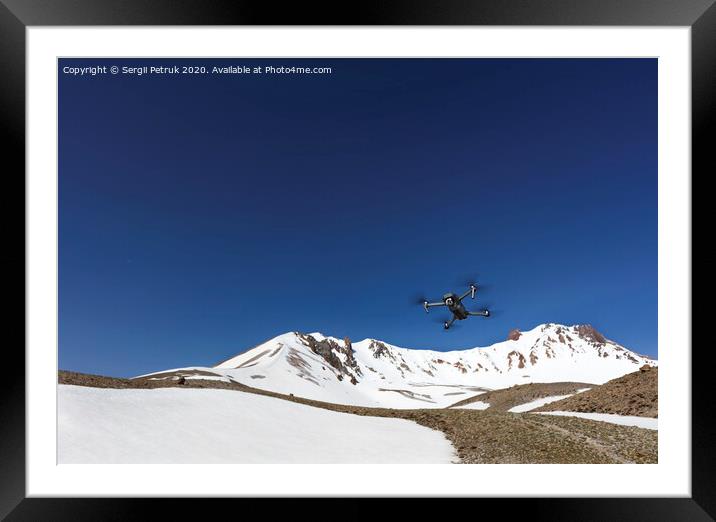 A flying toy hovered over the top of Mount Ercius against the blue sky. Framed Mounted Print by Sergii Petruk