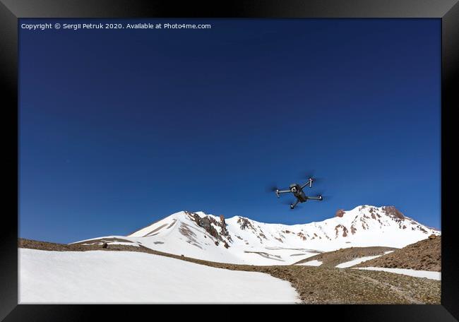 A flying toy hovered over the top of Mount Ercius against the blue sky. Framed Print by Sergii Petruk