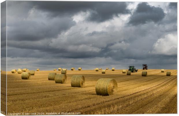 Bales and tractors Canvas Print by kevin cook