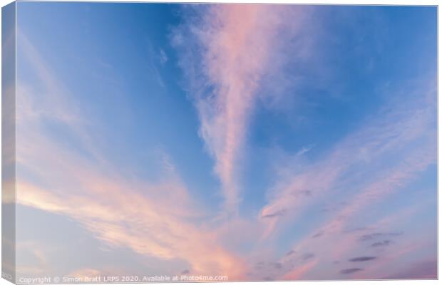 Pink cloud lines and blue skies Canvas Print by Simon Bratt LRPS