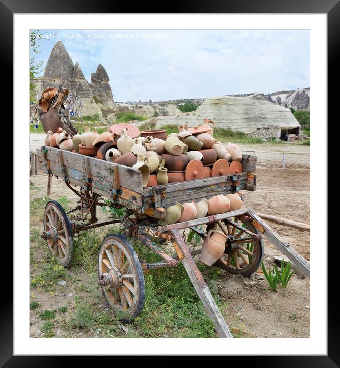 On an old wooden cart, a pile of clay jugs and pots Framed Mounted Print by Sergii Petruk