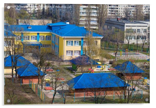 Bright blue roof of kindergarten against the background of gray urban high-rise buildings Acrylic by Sergii Petruk